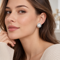 Pearl halo earrings worn on ear