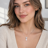 Pearl heart necklace worn by woman
