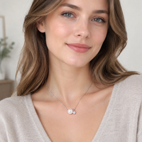 Freshwater pearl pendant necklace worn on neckline
